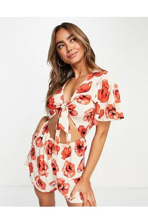 Monki Relaxed playsuit with tie front and frill sleeves in -Multi