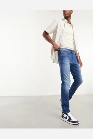 Tommy Hilfiger Austin slim tapered jeans in mid wash