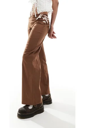 Reclaimed Flare pants in with pink bows & ribbon