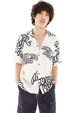 Dr Denim Madi short sleeve relaxed fit summer shirt with navy graphics in exclusive to ASOS-White