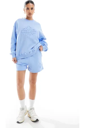The Couture Club Embossed shorts in light (part of a set)