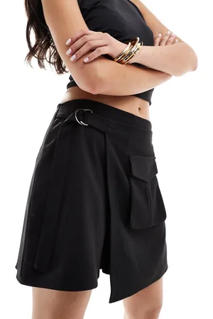 In The Style Pocket detail tie side mini skirt in