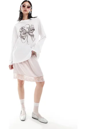 Monki Long sleeve relaxed fit top with bow print in