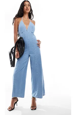 River Island Halter denim jumpsuit in lightwash blue