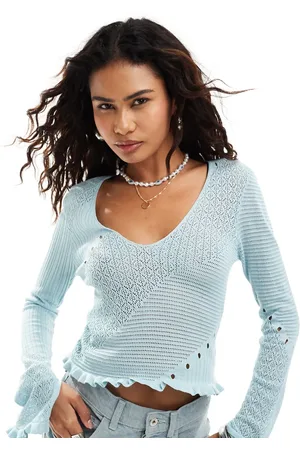 Monki Small rib v neck knit long sleeve top with hem detail in blue