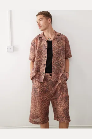 Reclaimed Unisex leopard print shorts