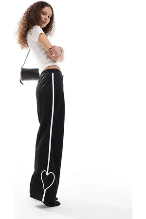 Monki Heart stripe straight leg track pants in with white stripes