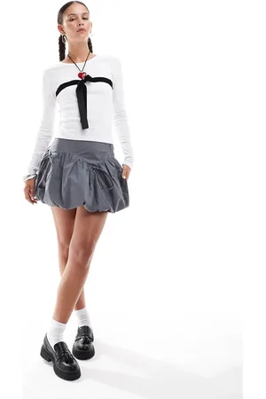 Glamorous Mid rise puff ball mini skirt with bow detail in