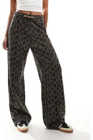 Monki Drawstring wide leg pants in with black side stripe detail