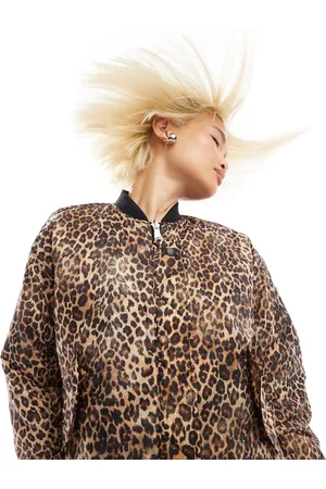 Monki Reversible oversized bomber jacket in black quilted star and leopard print-Multi