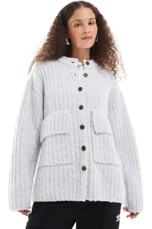 Monki Chunky knit rib high neck cardigan with button front and front flap pockets in
