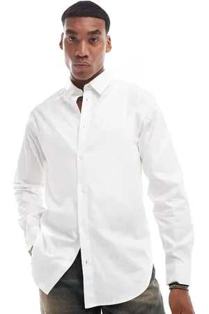 Armani Exchange All over logo printed long sleeve shirt with satin shine effect in