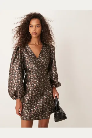 Glamorous V neck balloon sleeve mini dress with front wrap in 70s black floral
