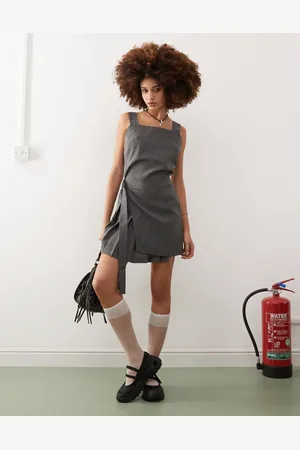 COLLUSION Kilted mini pinny dress with buckle detail in