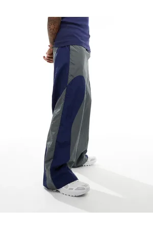 ASOS Baggy nylon track pants with blue panels in