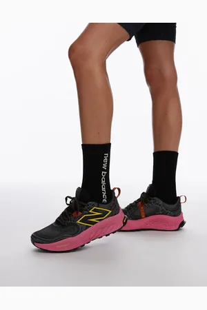 New Balance Hierro trail running trainers in black and pink