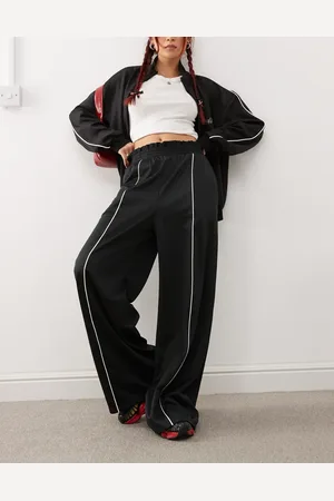 Monki Wide leg pull on track pants with front stripe in