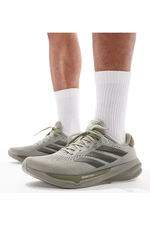adidas Adidas Running Supernova Stride 2 trainers in and navy
