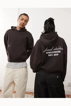 Reclaimed Unisex cropped boxy logo hoodie in -Brown