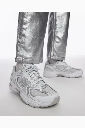 New Balance 530 sneakers in white and