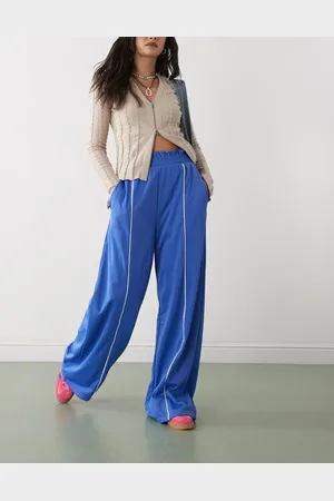 Monki Wide leg pull on track pants with white piping in