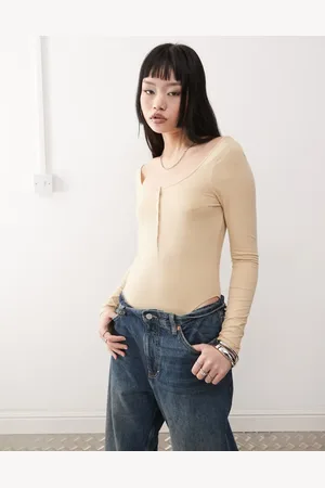 Monki Long sleeve bodysuit with button detail in -White