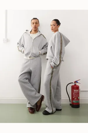 Reclaimed Unisex check side stripe wide leg trackies in