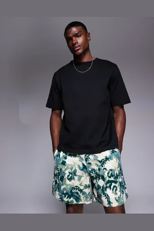 The North Face Class V Pathfinder logo shorts in green print
