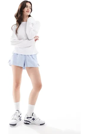 Hollister Pull on tie waist flippy shorts in blue and white stripe