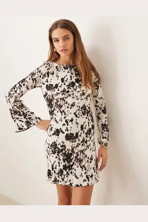 New Look Long sleeve mini dress in cow print-White