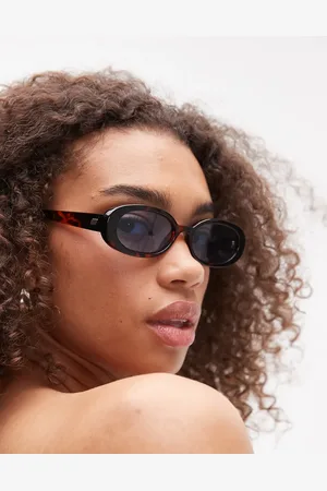 Le Specs Outta Love oval sunglasses in tortoiseshell with blue tint lens