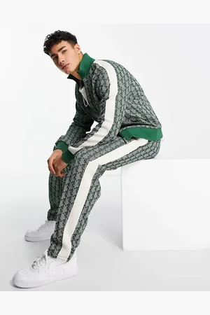 Lacoste All over print taped track pants in