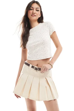 Monki Pleated mini skirt with white layered raw hem detail in -Neutral