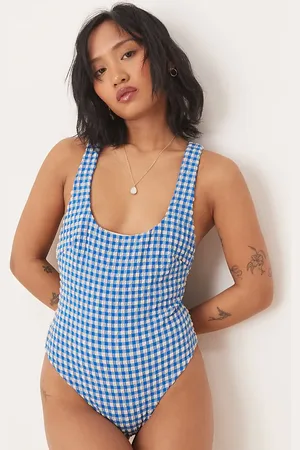 ASOS ASOS DESIGN Petite seersucker scoop swimsuit with giant bow back detail in