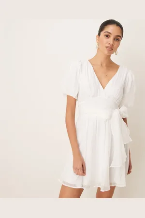Gina Tricot Short sleeve v neck open back bow graduation mini dress in