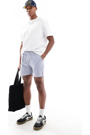 Another Influence Striped relaxed fit shorts in blue and white-Navy