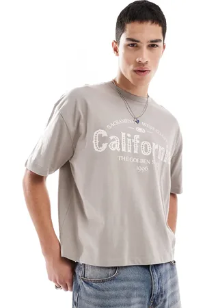ASOS Boxy oversized t-shirt with city graphic in brown