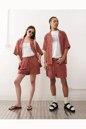 Reclaimed Unisex cord shorts in pink