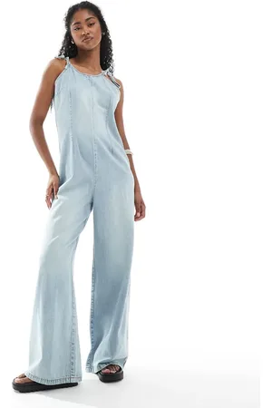 Monki Lightweight denim halter neck jumpsuit in blue wash