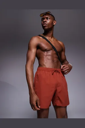 ASOS Swim shorts in mid length in -Brown
