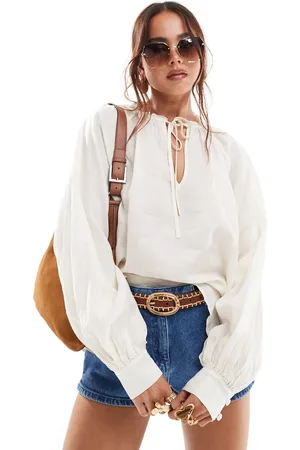 & OTHER STORIES Textured blouse with volume sleeves and bow tie neck detail in