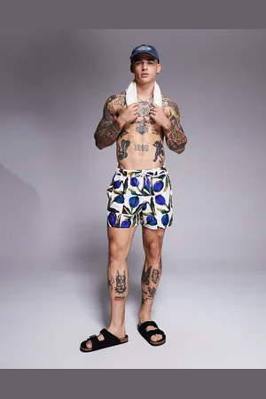 ASOS Swim shorts in short length with floral print in