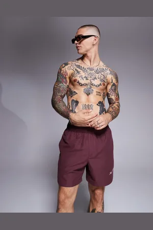 ASOS Swim shorts in mid length with embroidery in -Red