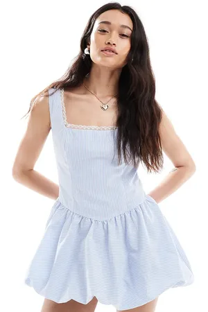 The Frolic Exclusive square neck lace trim puff ball mini dress in