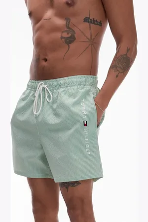 Tommy Hilfiger Side logo drawstring swim shorts in green stripe