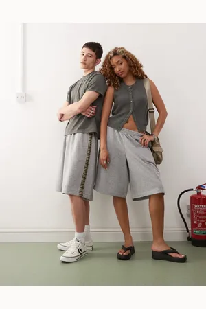 Reclaimed Unisex jersey shorts with check side detail in grey marl