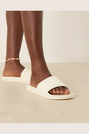 Calvin Klein Logo puff sliders in off white