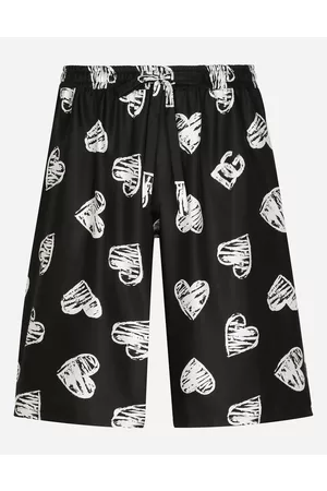 Dolce & Gabbana Men best seller selection - Silk jogging shorts with DG heart print