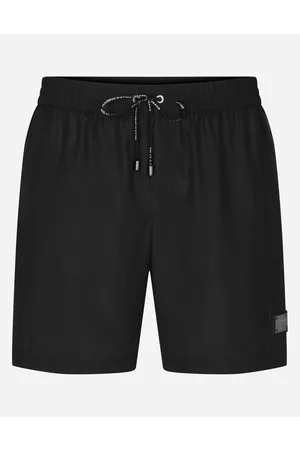 Dolce & Gabbana Beachwear - Mid-length swim trunks with branded plate