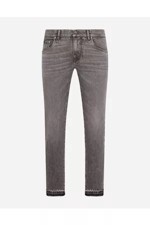 Dolce & Gabbana Men best seller selection - Light blue skinny stretch jeans with frayed turn-ups